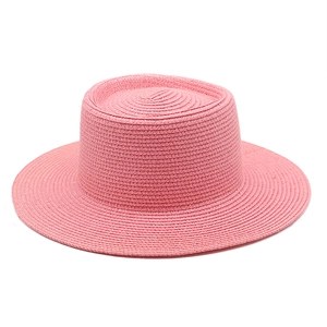 Pink wide brim straw sun hat with flat top design for summer beach outdoor protection