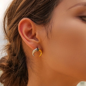 Two-tone crescent moon stud earrings in gold and silver steel with black stones