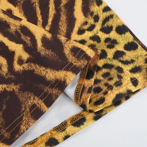 Macro shot of leopard print fabric showing professional stitching and high-quality seams