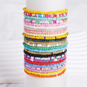 Bohemian stackable colorful beaded bracelet set featuring vibrant handmade round seed beads