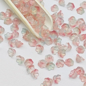 Top view of 7x12mm pink and blue gradient lily of the valley glass beads for DIY jewelry