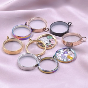 Polished stainless steel round glass locket pendants in various metallic colors on silk