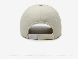 Detail of beige quilted winter baseball cap with adjustable hook and loop back strap