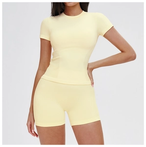 Detail of light yellow seamless high-waist yoga set showing ribbed texture and fit