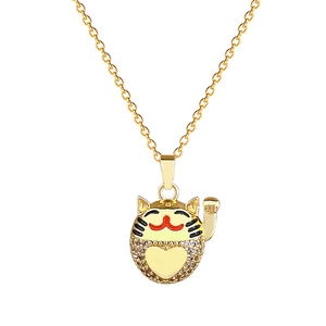 Golden Maneki Neko lucky cat necklace with sparkling rhinestones on white background