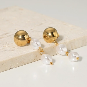 Elegant gold stainless steel earrings featuring cascading white baroque pearl tassels