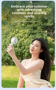 Detail of white portable handheld fan with digital display and integrated hanging clip
