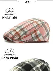 Close-up of pink and black plaid flat caps showing detailed tweed fabric texture