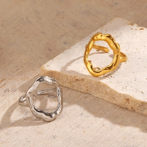 Minimalist irregular geometric hollow ring in gold and silver finish with lava texture