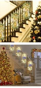 Detail of Christmas garlands with LED lights in gold and blue themes for stairs