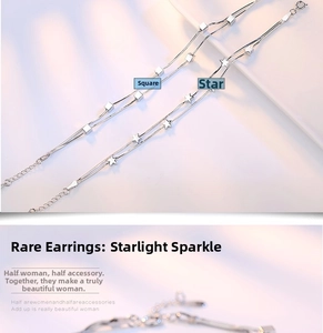 Detailed macro view of silver snake chains with square and star pendants