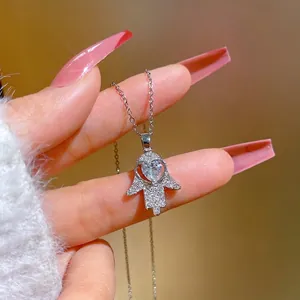 Hamsa hand pendant necklace with sparkling heart zircon and silver chain for women