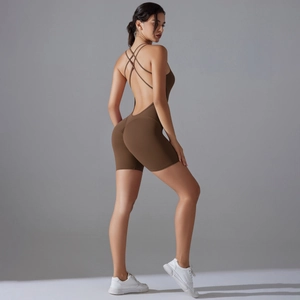 Detail view of deep brown yoga bodysuit with criss-cross back straps and scrunch butt design