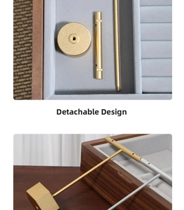 Detailed view of the detachable gold jewelry stand parts on a gray velvet tray