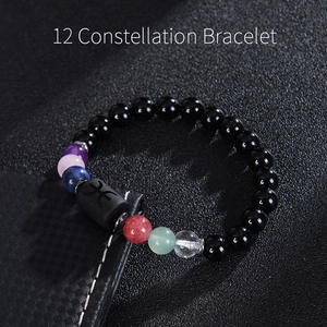 Handcrafted 12 Constellation bracelet featuring black obsidian beads and zodiac charm