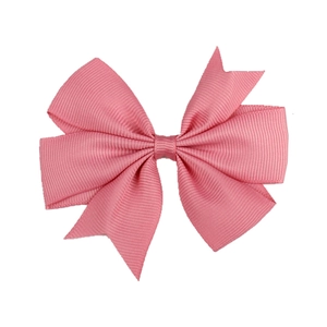 Detailed view of pink grosgrain ribbon texture and swallowtail bow design
