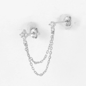 Detailed macro view of S925 sterling silver double chain earrings with pavé flower stud