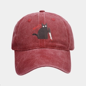 Detail of funny cat with knife embroidery on vintage washed cotton baseball cap