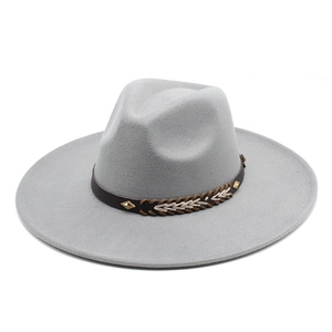 Detail of wide brim gray fedora hat with brown leather band and metallic diamond studs