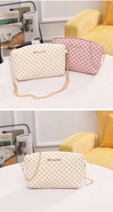 Close-up of small crossbody bags with floral prints and elegant gold chain straps