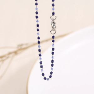 Bohemian blue beaded necklace with stainless steel lobster clasp on a clean background