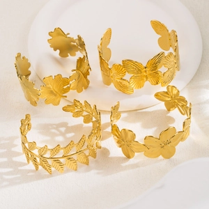 Gold stainless steel bangles set featuring butterfly flower and leaf textured designs