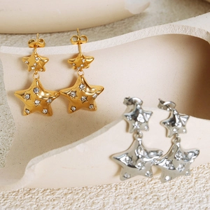 Star-shaped titanium earrings with sparkling zircons in gold and silver finish