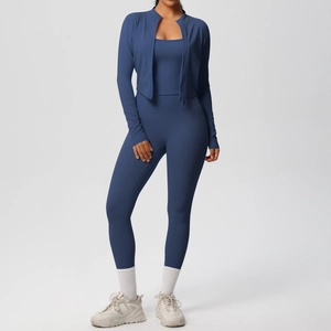 Detail of dark blue three-piece yoga set with zip jacket, sports bra and high waist leggings