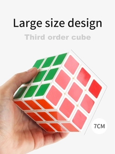 Close-up of 7cm large size third-order magic cube held in hand for educational play