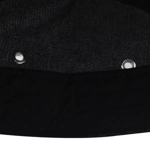 Close-up of black cotton denim baseball cap detail with silver metal eyelets and stitching