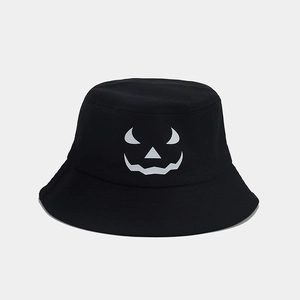 Detail of the high-quality black cotton fabric texture on the Halloween pumpkin face bucket hat