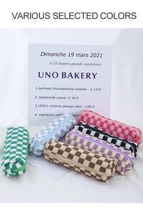 Various colors of knit checkerboard pencil cases in green, blue, brown, and purple