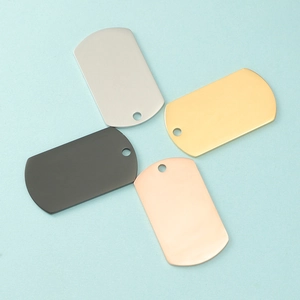 Close-up of mirror polished stainless steel dog tags in silver, gold, black, and rose gold