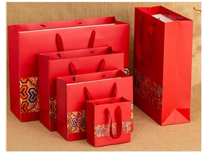 Detail of red Chinese style gift bags with traditional patterns in various sizes