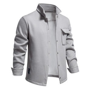 Macro view of light grey waffle texture fabric and front chest pocket on jacket