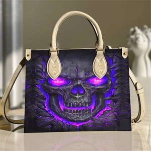 Gothic skull print large tote bag in purple and black leather with cream handles