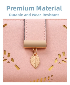 Close-up of pink long wallet with laser-cut leaf pattern and golden metal pendant