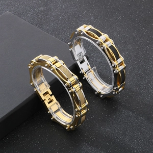Detail of masculine mesh motorcycle chain bracelets in gold, silver, and black stainless steel