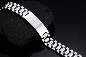 Macro view of polished silver stainless steel bracelet with a smooth rectangular bar