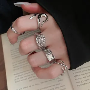 Minimalist silver geometric irregular open ring set with five unique metallic textures