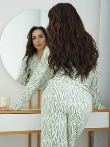 Detailed back view of green zebra print pajama set featuring long sleeves and loose trousers
