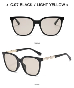 Square black sunglasses with light yellow lenses and pearl bead temple accents