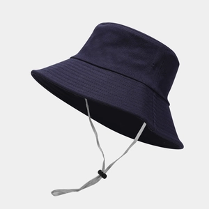 Detail of navy blue bucket hat with adjustable chin cord and reinforced brim stitching