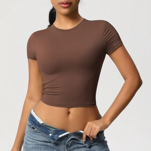 Close-up of a brown slim-fit cropped yoga t-shirt with high-elastic matte fabric