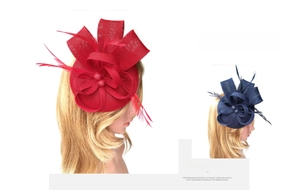 Detail of red and navy blue feather fascinator headband with mesh bow and beads