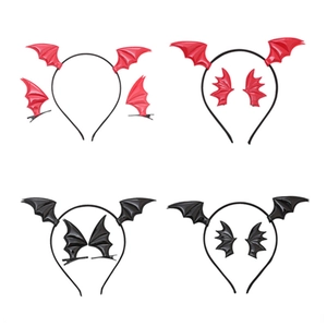 Close-up of Halloween bat wing headbands and matching clips in red and black colors