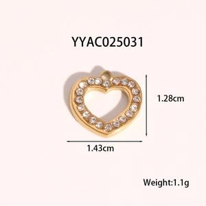 Detailed view of a gold heart pendant with sparkling crystals and size dimensions