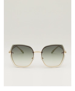 Detail view of large frameless sunglasses with green yellow gradient lenses and gold temples