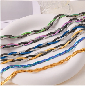 Detailed macro view of multi-color triple-braided titanium steel flat snake chain necklaces