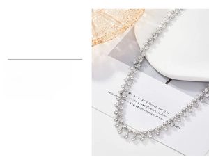 Detailed macro view of S925 silver necklace with sparkling zircon and gold plating